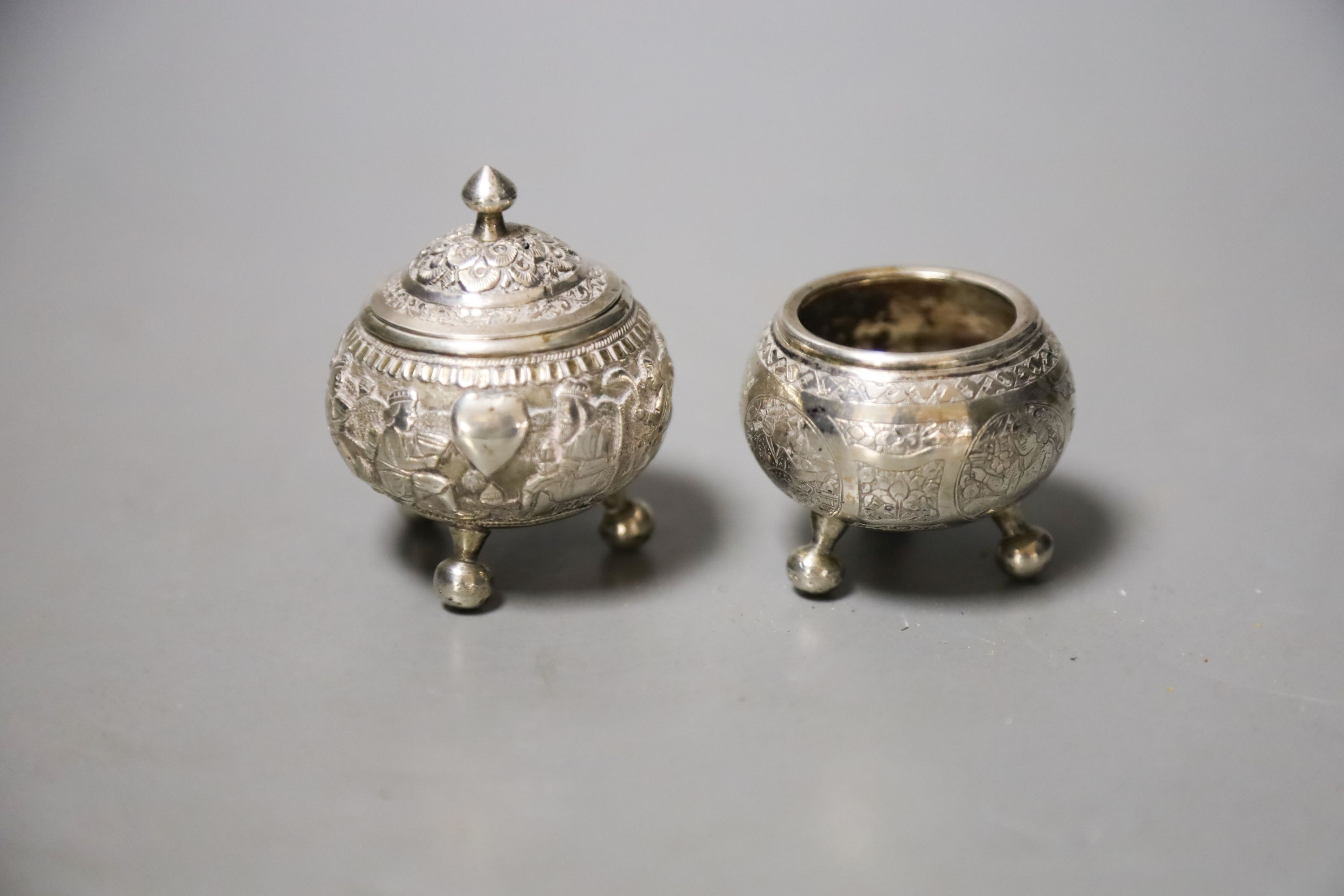 Two small Indian white metal condiments, tallest 57mm.